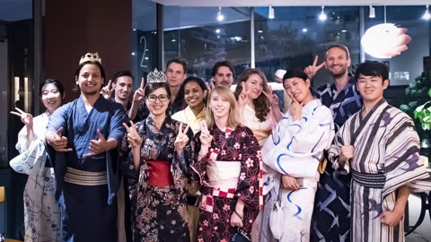 Group of people in yukatas posing indoors.
